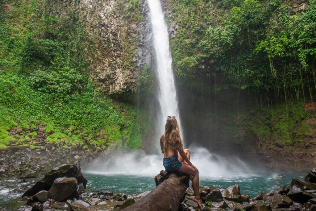 A-lady-enjoys-the-view-of-LA-Fortuna-Waterfall